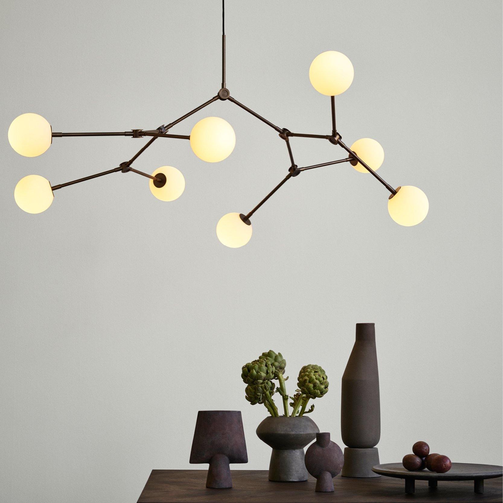 101 Copenhagen DROP BULB Chandelier turned on over a composition of vases- Luminesy